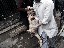 Un civil gravement blessé est transporté vers l’hôpital Dar al-Shifa, avant d’être évacué en Turquie pour y recevoir des soins médicaux vitaux.
<br><i><b>

A civilian with severe wounds is taken from Dar al-Shifa hospital to be sent to Turkey for life-saving treatment.
</b></i><br><i>© Sebastiano Tomada - Sipa Press - 2013</i>
